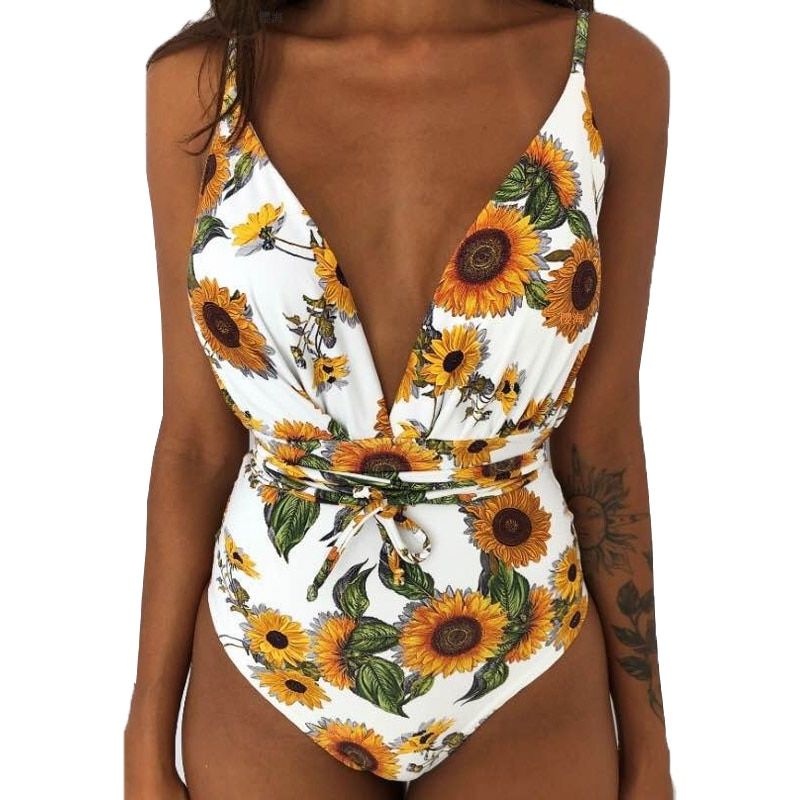 Traje de baño de una pieza con espalda descubierta, escote profundo en V y lazo en la cintura Enteriza Trajes de baño Color : Flores Turquesa|Leopardo Blanco|Negro|Flores Amarillas|Rayas negras|Pájaros|Flores Blanca|Flores Fucsia Y Azul|Palmeras|Flores Fucsia y Amarillo|Celeste|Margaritas El Vestidor de Carlota